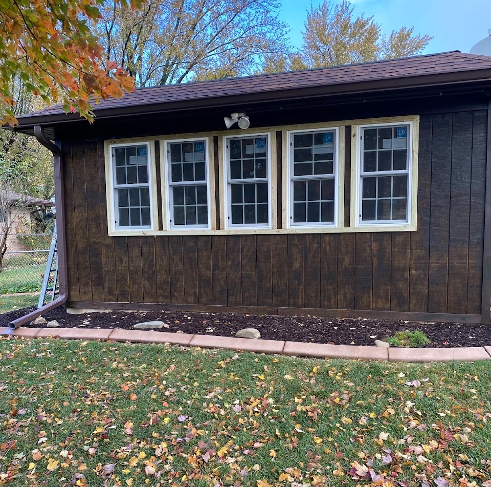 Sun Porch framed in windows with new siding
